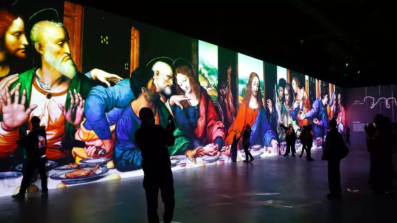 Visitors interact with a large digital display of Leonardo da Vinci's "The Last Supper," featuring vibrant colors and dynamic projections.