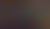 A conductor leads a large orchestra during a rehearsal, with musicians seated at music stands in a concert hall setting.
