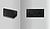 Two black speakers are displayed: one is angled on a gray surface, and the other is mounted flat against a textured wall.