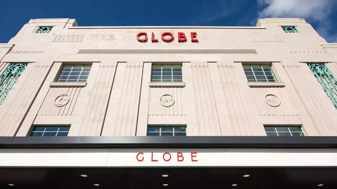 Art Deco building facade featuring the word "GLOBE" prominently displayed in red letters against a light-colored background.