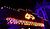 Neonschild mit der Aufschrift "WINTERTHEATER", das nachts beleuchtet ist, umgeben von dekorativen Lichtern und einem stilisierten Fuchs-Logo darüber.
