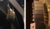 Two views of audio speaker stacks: one suspended from a ceiling in a theater, the other positioned vertically against a wall.