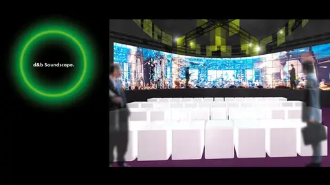 A modern event space featuring white seating arranged in front of a large, vibrant screen displaying a cityscape and colorful visuals.