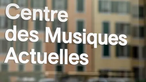 Sign displaying "Centre des Musiques Actuelles" and "Ecoles de musique," indicating a music center or school.