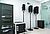 Audio equipment setup featuring a rack of electronic devices and three mounted speakers in a modern room.