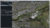 Map interface displaying a detailed urban layout with roads, buildings, and green spaces, alongside a panel for navigation and settings.