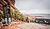 Red Rocks Amphitheatre with empty seating, surrounded by rocky formations and trees, under overcast skies.