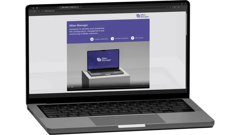 Laptop displaying a presentation about Milan Manager, focusing on design and management of Milan interfaces.
